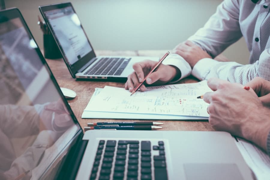 Estimator reviewing bid spreadsheets and documents
